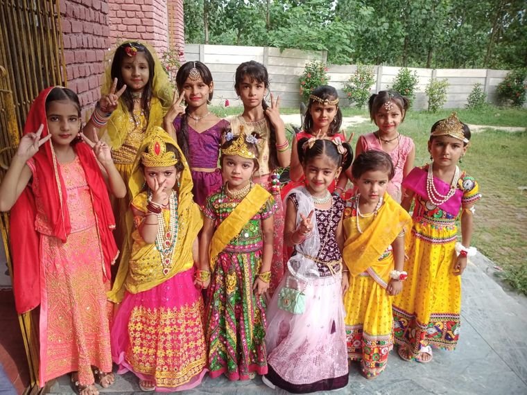 Students in traditional dress for the Janmashtami celebration at Janhit World School