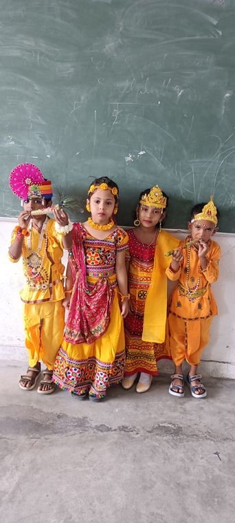 Kindergarten children of Janhit World School dressed as Krishna and Radha for Janmashtami